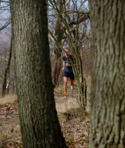 Andrzej Witek running in the forest
