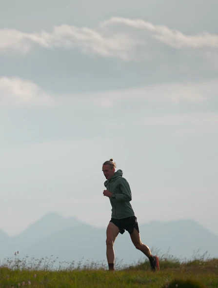 Andrzej Witek running on a mountain ridge